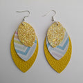 Pair of yellow leaf-shaped earrings with glittery accents 