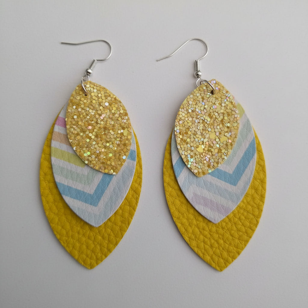 Pair of yellow leaf-shaped earrings with glittery accents 